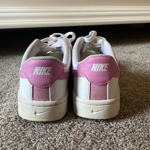 NIKE, low top nikes, pink swoosh, women’s size 8.5